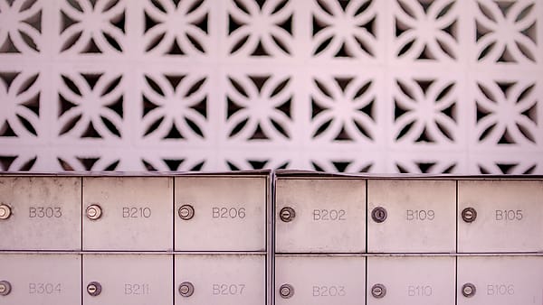 A bank of numbered mailboxes in Ocean City, United States, each with its own lock and letter slot