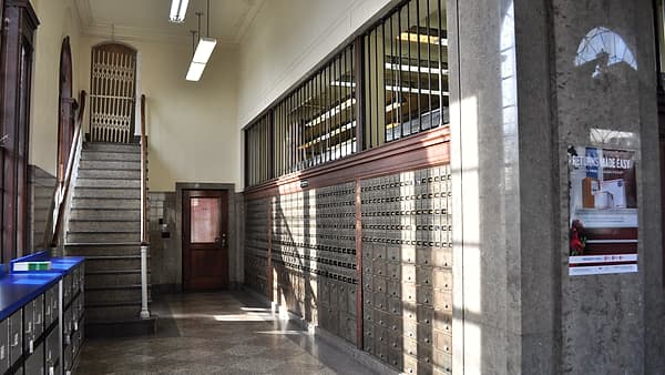 The public interior of the main post office in Chehalis, Washington, with its counter and service windows