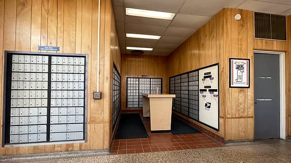 The public interior of the post office at Beech Grove, Indiana, with the service counter along one wall