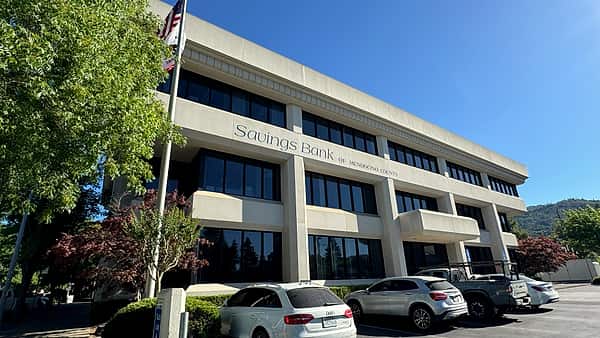The Savings Bank of Mendocino County building on the street in Ukiah, California, seen from the sidewalk
