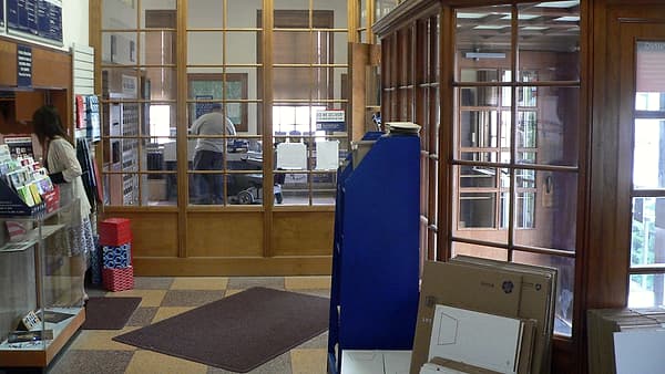 The interior of the post office at Russell, Kansas, with the entrance at the right of the frame
