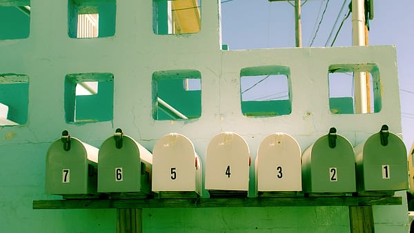 A wall of numbered mailboxes on 45th Street in Ocean City, United States, each with its own small door
