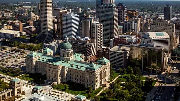 An aerial view east across downtown Indianapolis, Indiana, with the Indiana Statehouse in the foreground