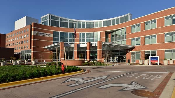 The main entrance to Suburban Hospital on Old Georgetown Road in Bethesda, Maryland, seen from the drive