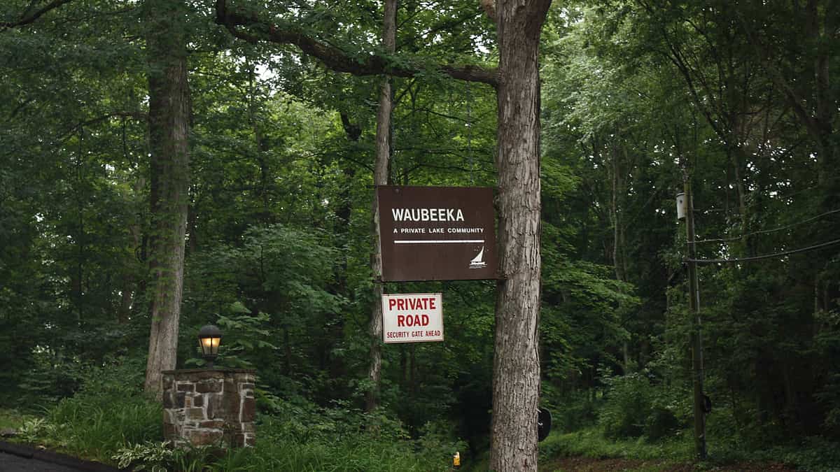 The entrance sign at Lake Waubeeka in Danbury, Connecticut, standing at the road into the community
