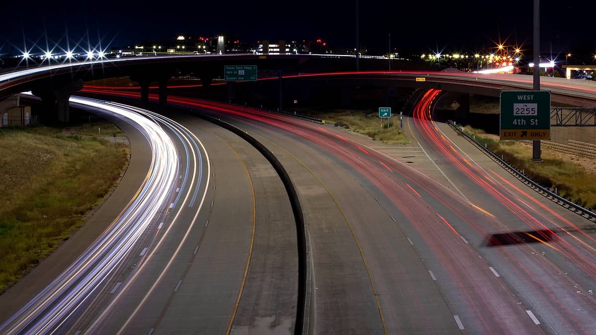 A long exposure of headlight and taillight trails along the Marsha Sharp Freeway in Lubbock, Texas