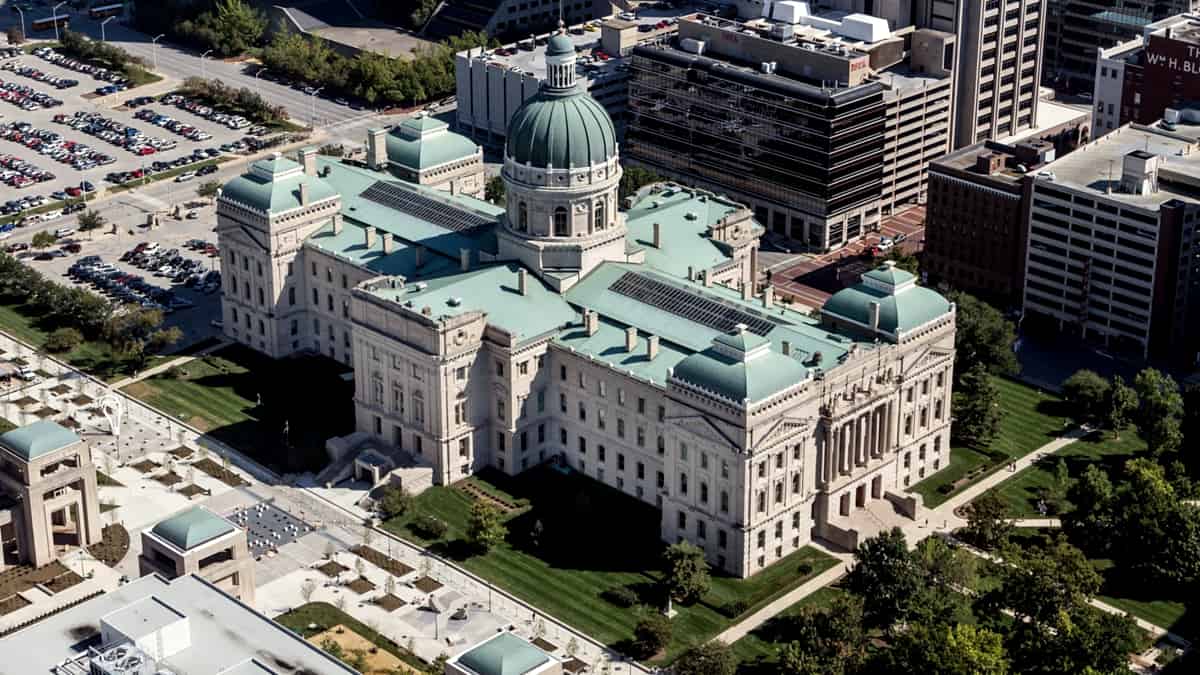 An aerial view of Indianapolis, Indiana, with the Indiana State House standing among the surrounding blocks