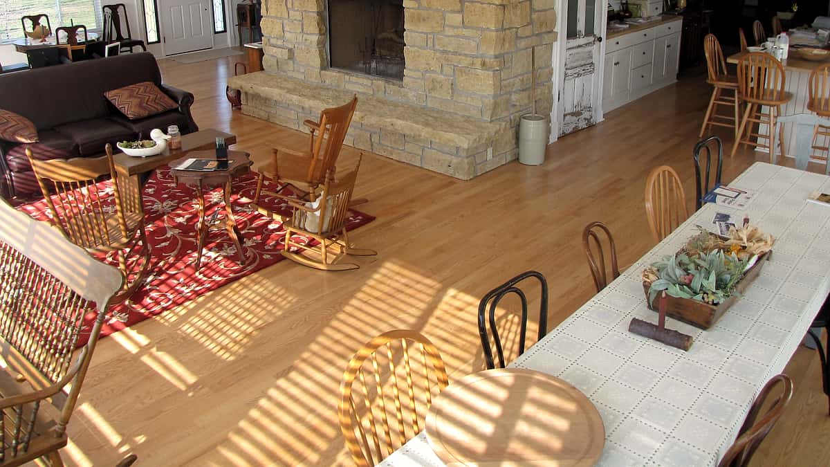 The well-kept interior of a private house on Taft Speedway, its front room furnished and lit from the windows
