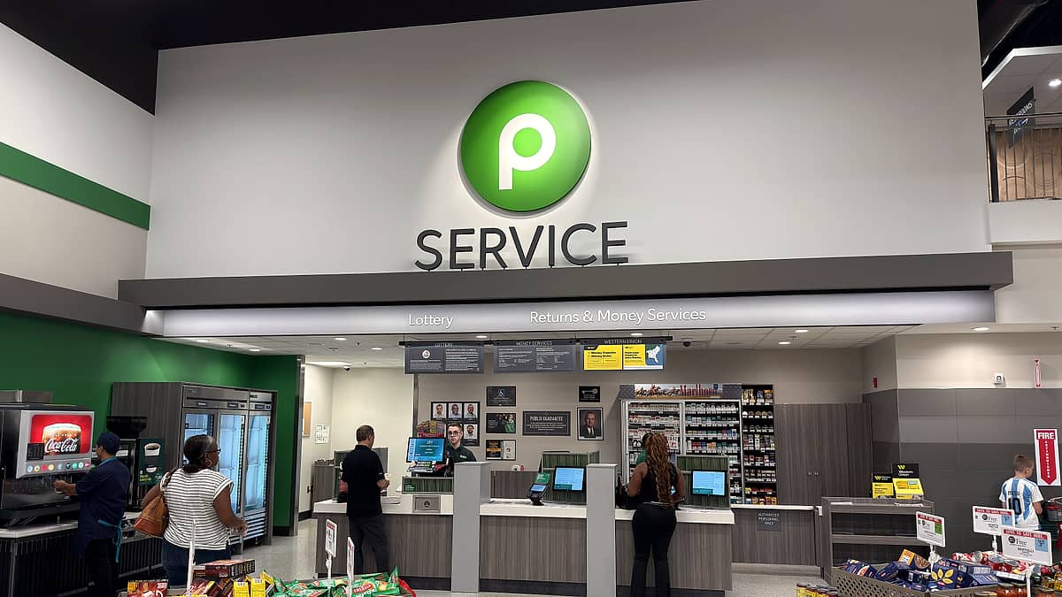 The customer service counter at a grocery store in Orlando, Florida, with its signage above the window