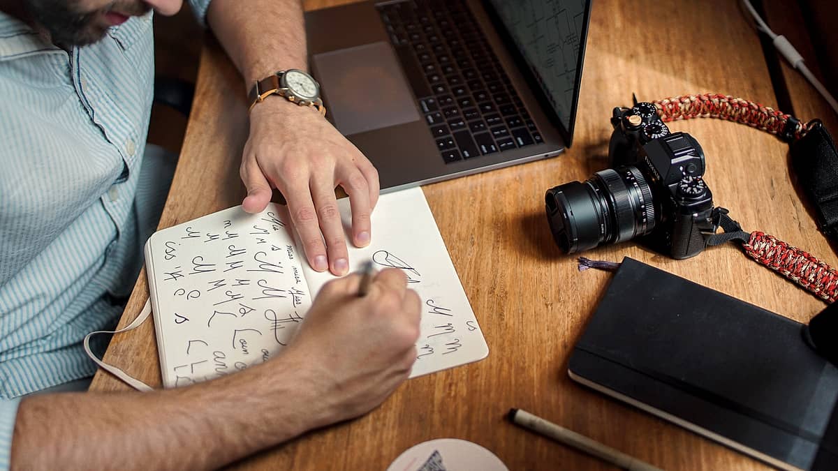 An open notebook and pen on a working surface in Dallas, United States, with a draft written across the page