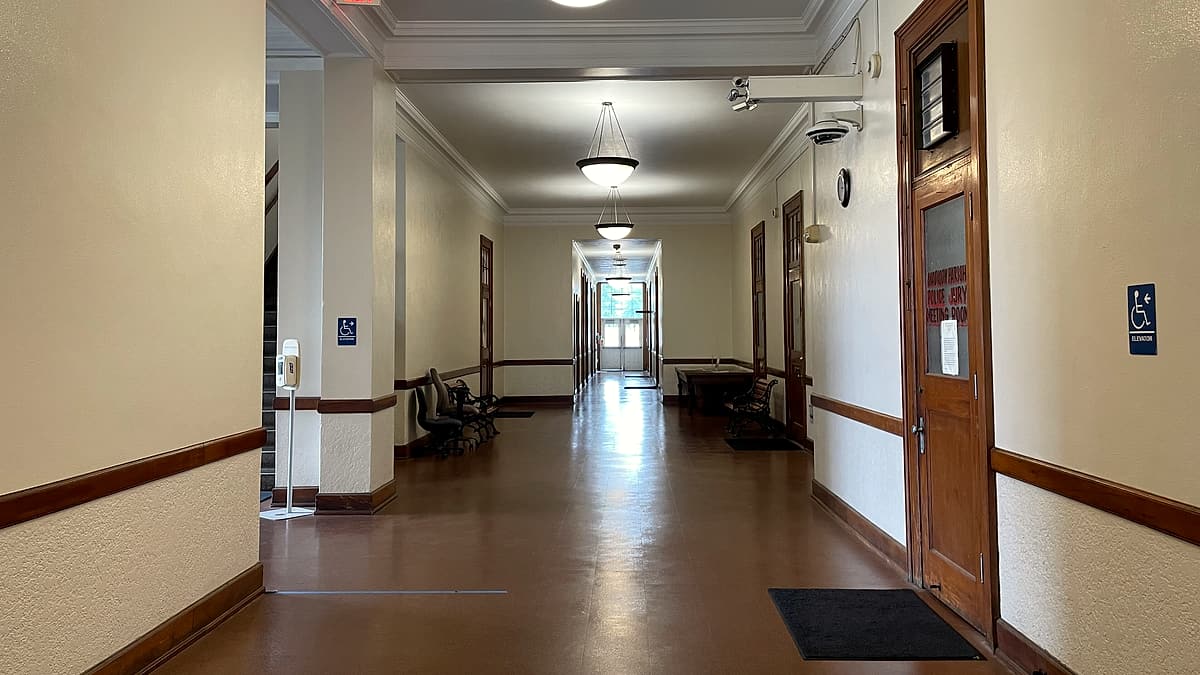 A first floor hallway inside the Madison Parish Courthouse in Tallulah, Louisiana, with doors along one side