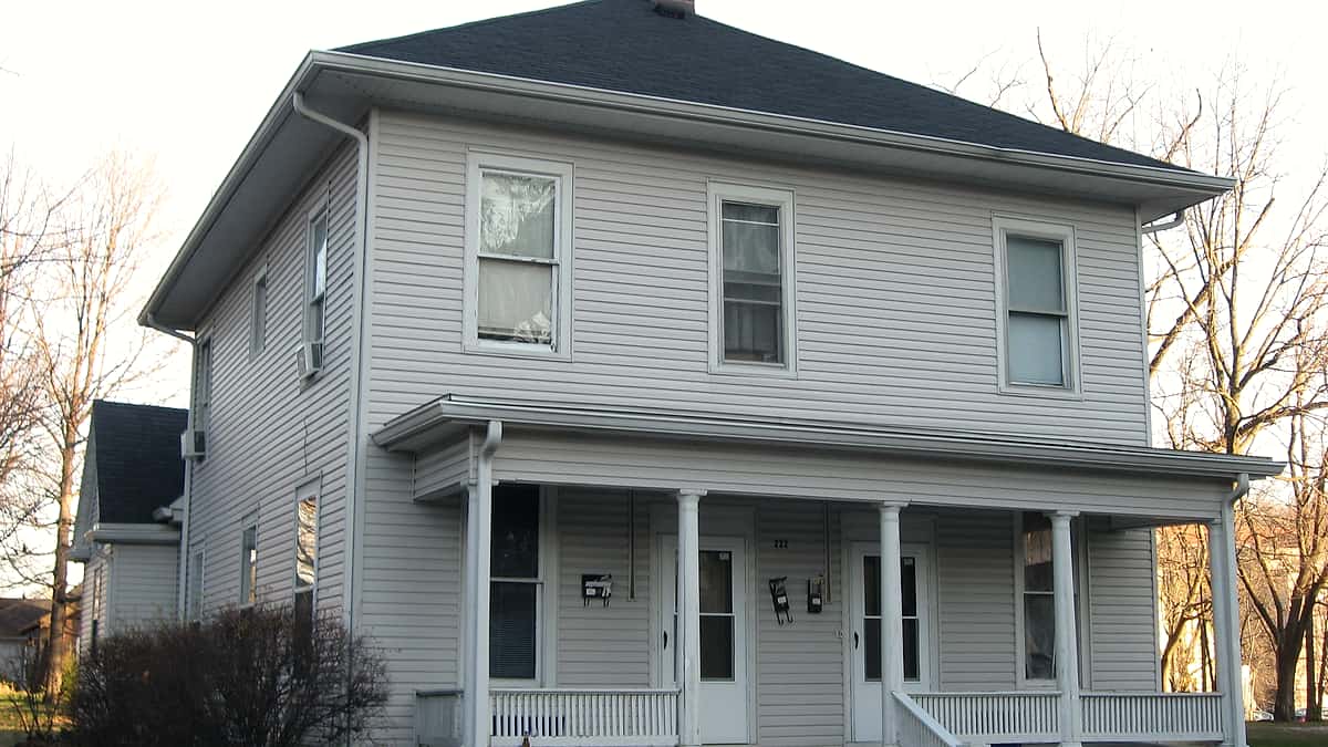 The front and northern side of a house on North Dunn Street in Bloomington, Indiana, behind its yard